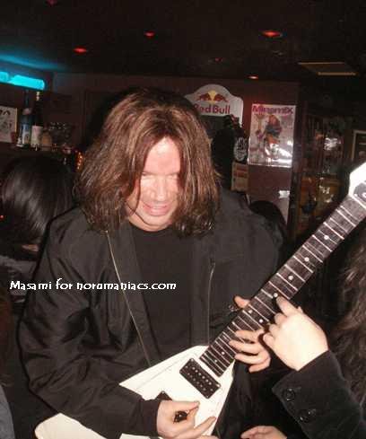 johnplayinaguitarmadeofpaper.jpg
